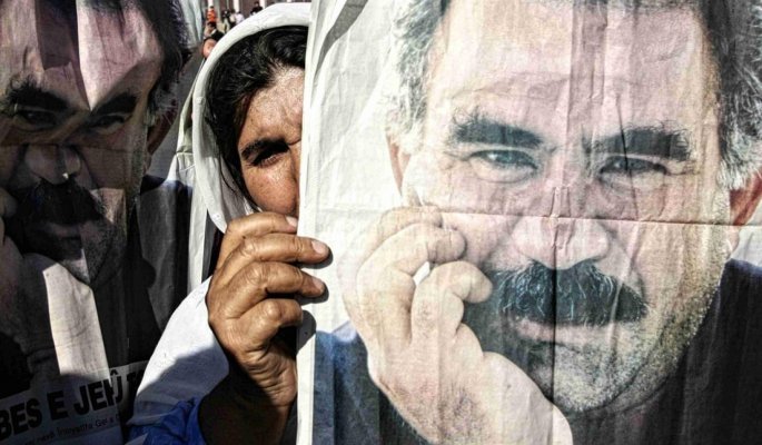 A kurdish woman holds a poster of abdullah ocalan at a protest in silopi near the turkish iraq border i november 2007 (afp)