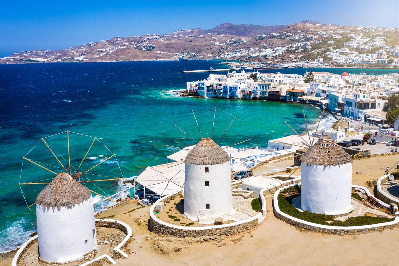 Aerial,view,through,the,famous,windmills,above,mykonos,town,,cyclades,